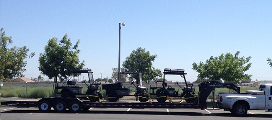 Side-by-side UTVs on transport trailer